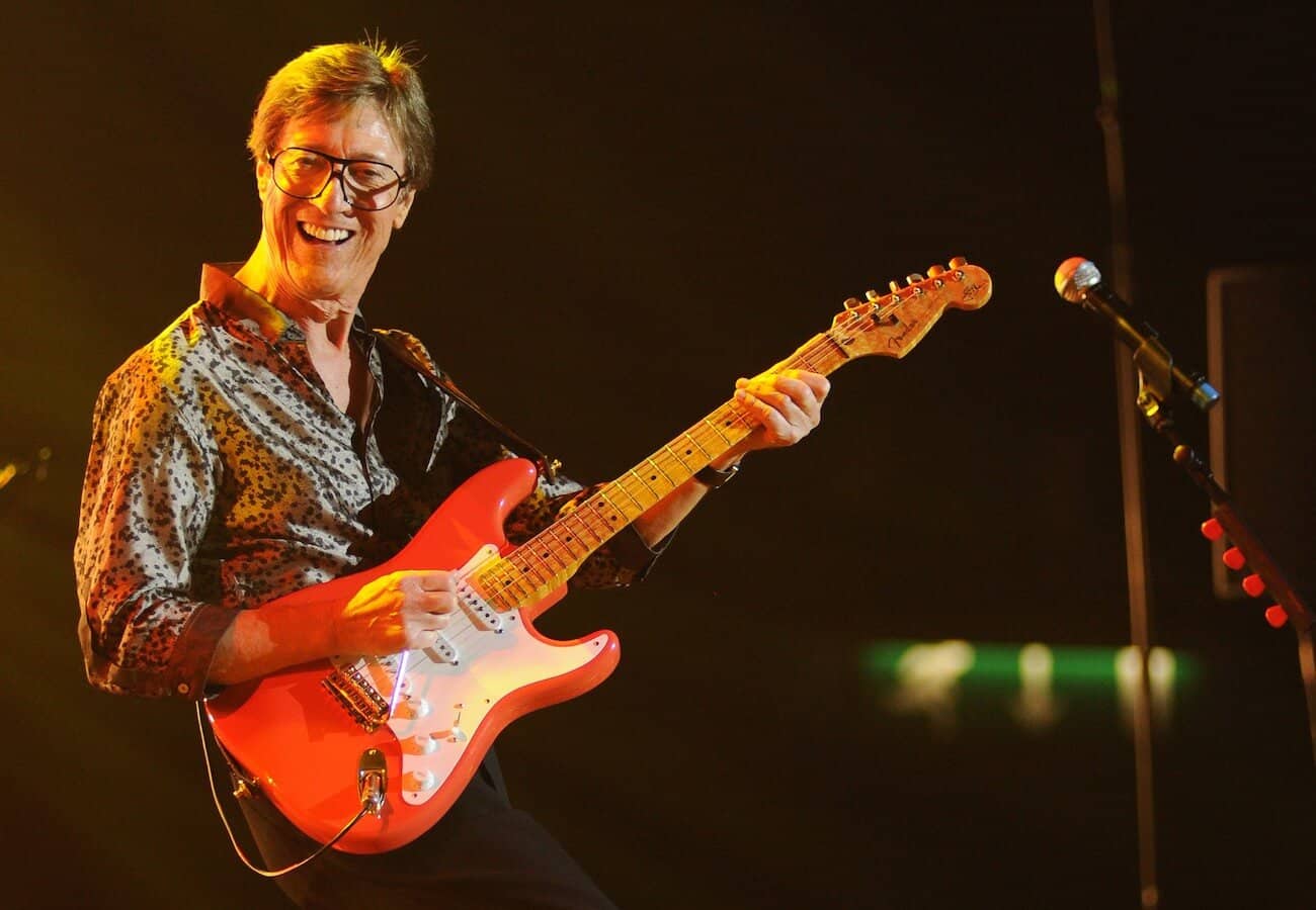 Hank Marvin playing guitar live.