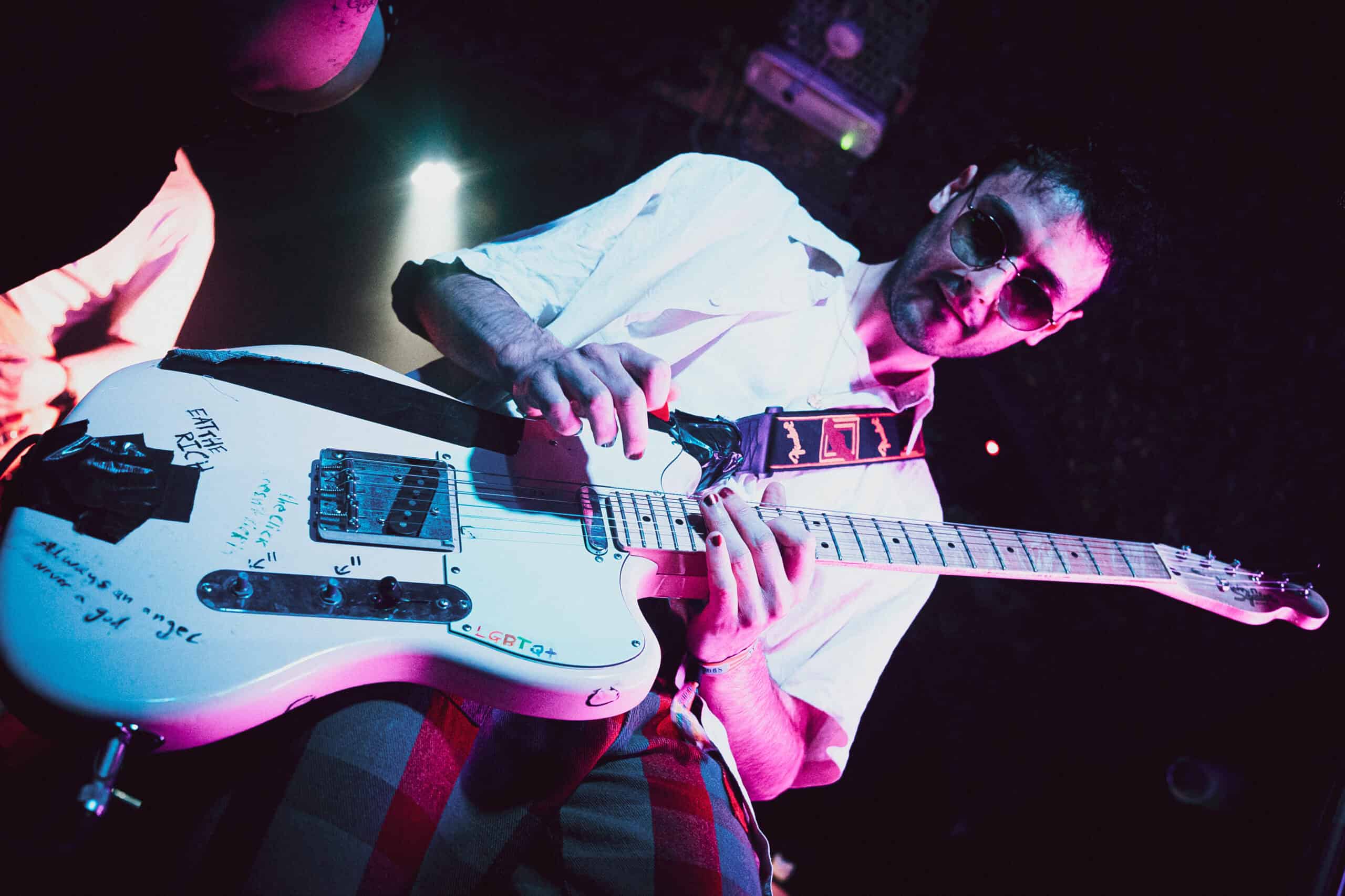 A WaterBear musician playing guitar.