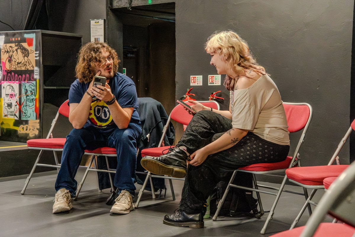 Music marketing professionals discussing promotion strategies - highlighting marketing and PR careers and jobs in the music business industry.